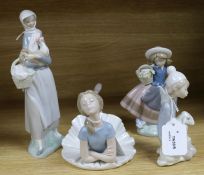 Four Lladro figures, 'Ballet Blue', No. 1359, 'Girl with Cockerel', No. 4591, 'Sweet Scent', No.