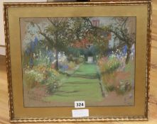 Lucy Kemp Welch, pastel, house and garden, signed and dated 1925, 29 x 34cm