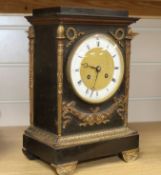 A 19th century French Napoleon III bronze and ormolu mantel clock, applied with columns and swags, H