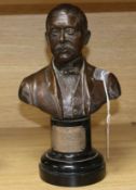 A bronze bust of Sir Charles Henry Hawtrey (Actor-Manager, 1858-1923), signed Garrard, on ebonised