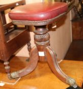 A late Georgian mahogany adjustable piano stool