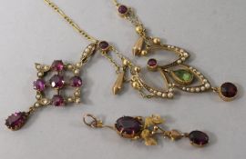 An Edwardian 9ct gold and gem set pendant necklace and two other 9ct gold and gem set pendants,