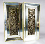 A pair of Chinese giltwood panels with later bevelled mirror frames, the 19th century Chinese