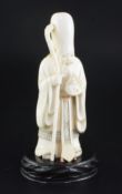 A Japanese ivory figure of Fukurokuju, early 20th century, holding a flaming jewel in his left hand,
