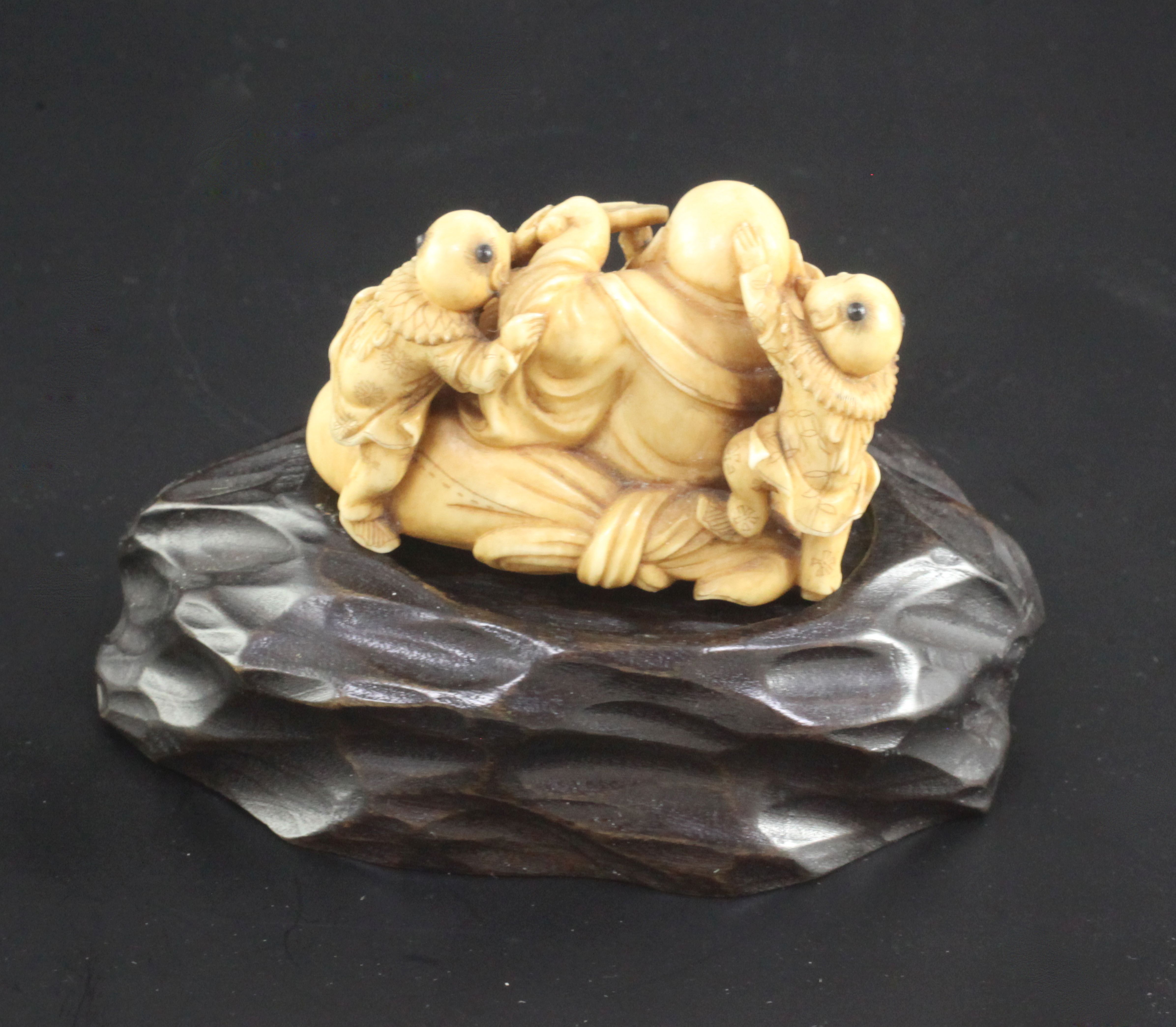 A Japanese ivory okimono of Hotei and three boys, signed Ikkosai, Meiji period, the boys - Image 2 of 3