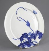 A fine Japanese blue and white 'month' plate, c.1890, by Seifu Yohei III (1851-1914), moulded in