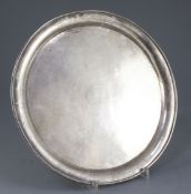 A Chinese silver circular salver, early 20th century, the border engraved with flowers and