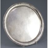 A Chinese silver circular salver, early 20th century, the border engraved with flowers and