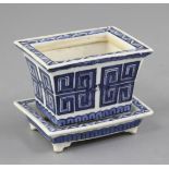 A Chinese blue and white rectangular flower pot and stand, 19th century, painted with archaistic