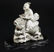 A Japanese ivory okimono of Kinko riding a carp, signed Ichyosen Naohide, 19th century, carved