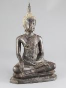 A Thai bronze seated figure of Buddha, 19th / 20th century, on a stepped throne, 38cm