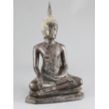 A Thai bronze seated figure of Buddha, 19th / 20th century, on a stepped throne, 38cm