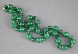 A single row of green jadeite beads, the modern clasp stamped 375, beads range from 6mm - 12mm,