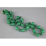 A single row of green jadeite beads, the modern clasp stamped 375, beads range from 6mm - 12mm,