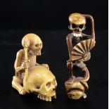 Two Japanese ivory okimono / netsuke of skeletons, 19th century, the first of a skeleton seated