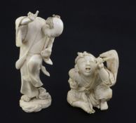 Two Japanese ivory okimono, Meiji period, the first carved as a seated boy holding a fan,