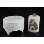Two Japanese ivory jars and covers, early 20th century, the first carved in relief with animals,