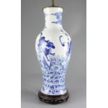 A Chinese blue and white 'mythical beasts' baluster vase, late 19th century/early 20th century,