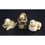 Three Japanese ivory netsuke, 19th century, the first of a Samurai drinking broth from a pot,
