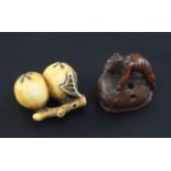 Two Japanese netsuke, 19th century, the first carved as two persimmon fruit in ivory, two