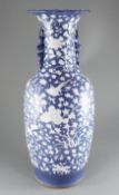 A large Chinese blue ground baluster vase, late 19th century, decorated in white slip with cranes