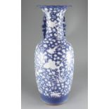 A large Chinese blue ground baluster vase, late 19th century, decorated in white slip with cranes