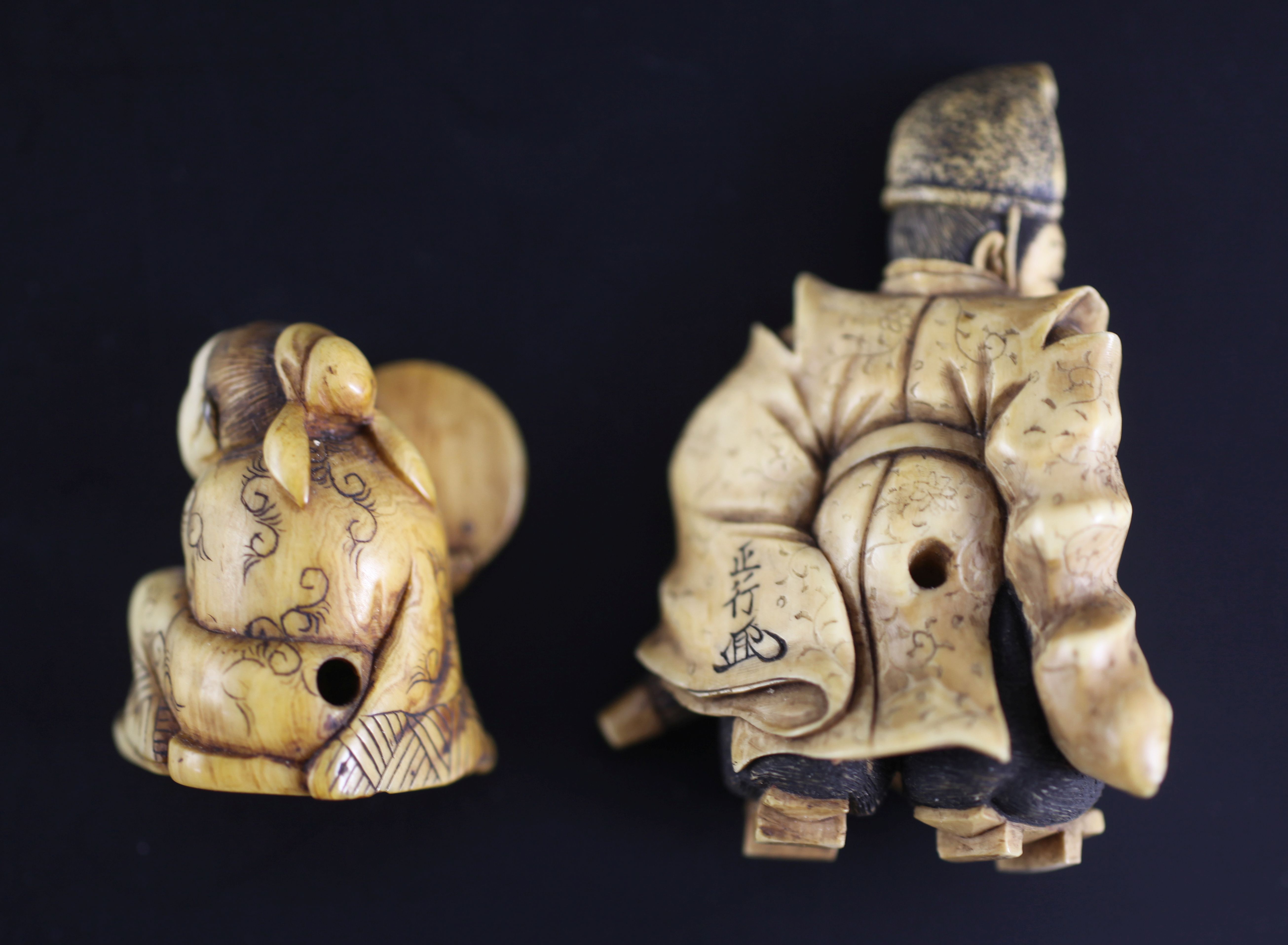 Two Japanese ivory netsuke, 19th century, the first of a priest holding a parasol, signed Sei..?, - Image 2 of 3