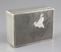 A Japanese silver and shibuichi rectangular box, early 20th century, with hardwood lining, the cover