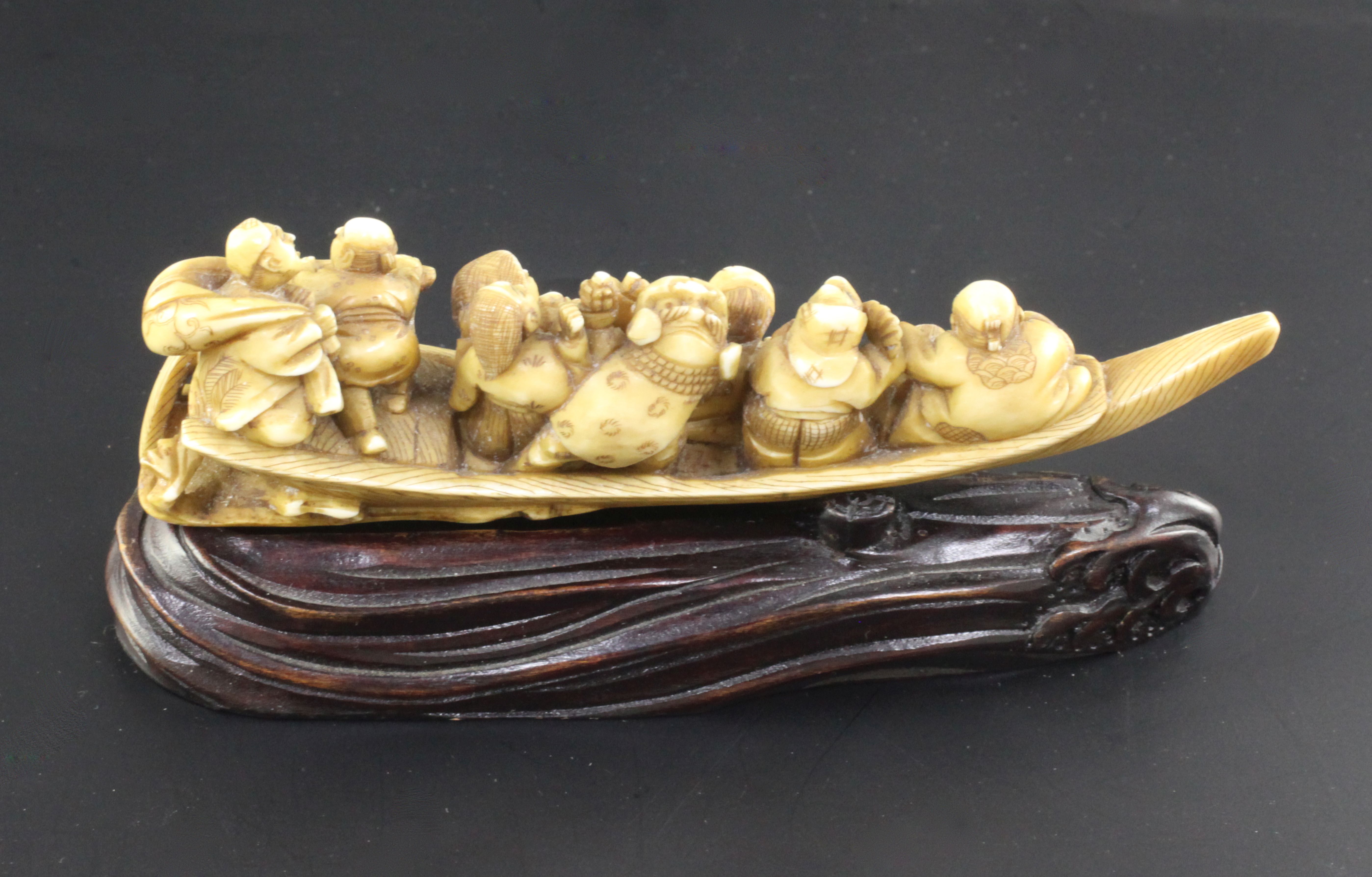 A Japanese ivory okimono of figures enjoying festivities on a boat, Meiji period, playing music - Image 2 of 3