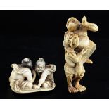 Two Japanese ivory netsuke of wrestlers, 19th century, the first of two arm wrestlers seated on a