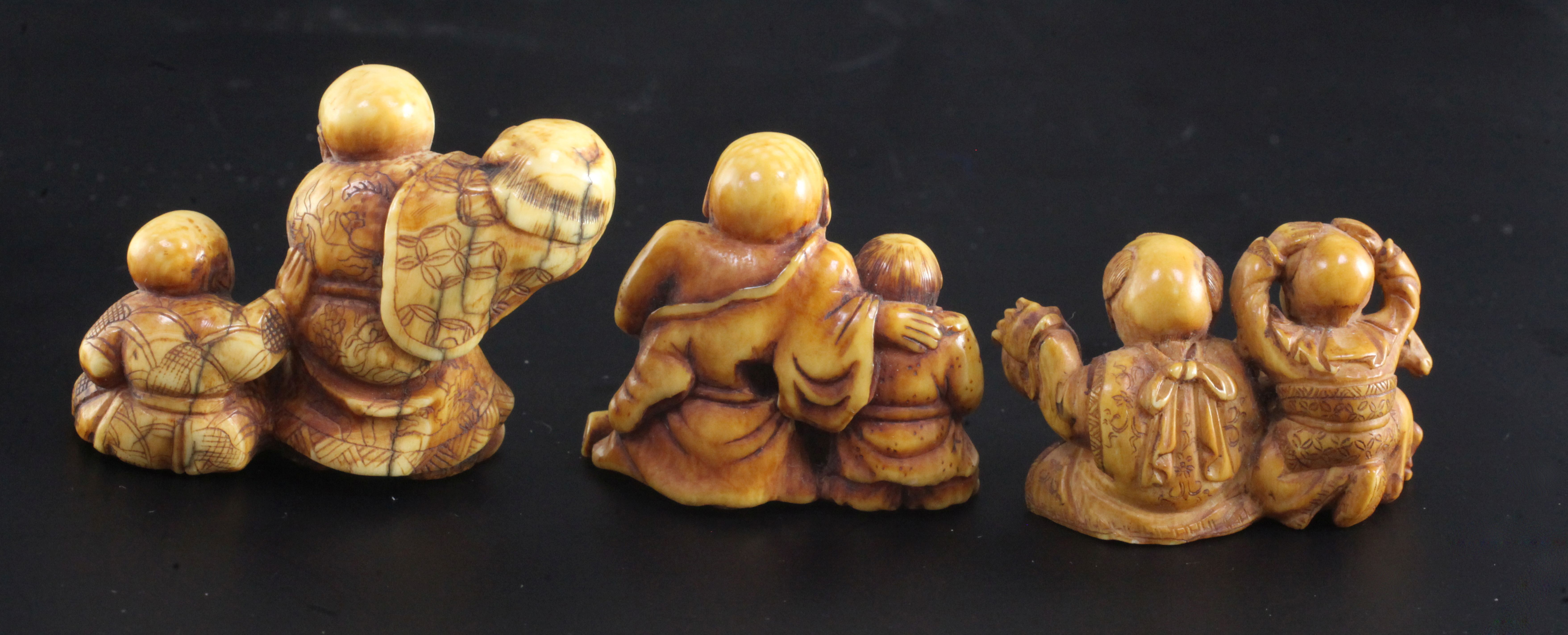 Three Japanese ivory netsuke of children, 19th century, the first modelled with two boys with a - Image 2 of 3