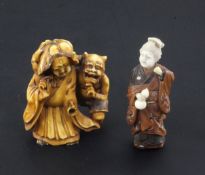 Two small Japanese okimono, 19th / early 20th century, the first in stained ivory carved as a lady