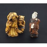 Two small Japanese okimono, 19th / early 20th century, the first in stained ivory carved as a lady