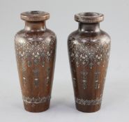 A pair of Turkish hardwood and silver inlaid vases, dated 1914, decorated with repeating arabesque