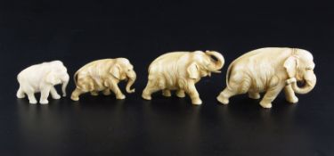 A Japanese graduated set of four ivory figures of elephants, in various poses, length 5.2cm - 9.3cm