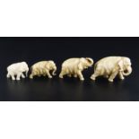 A Japanese graduated set of four ivory figures of elephants, in various poses, length 5.2cm - 9.3cm