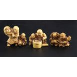 Three Japanese ivory netsuke of children, 19th century, the first modelled with two boys with a