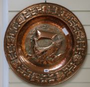 A Newlyn style embossed copper charger