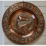 A Newlyn style embossed copper charger