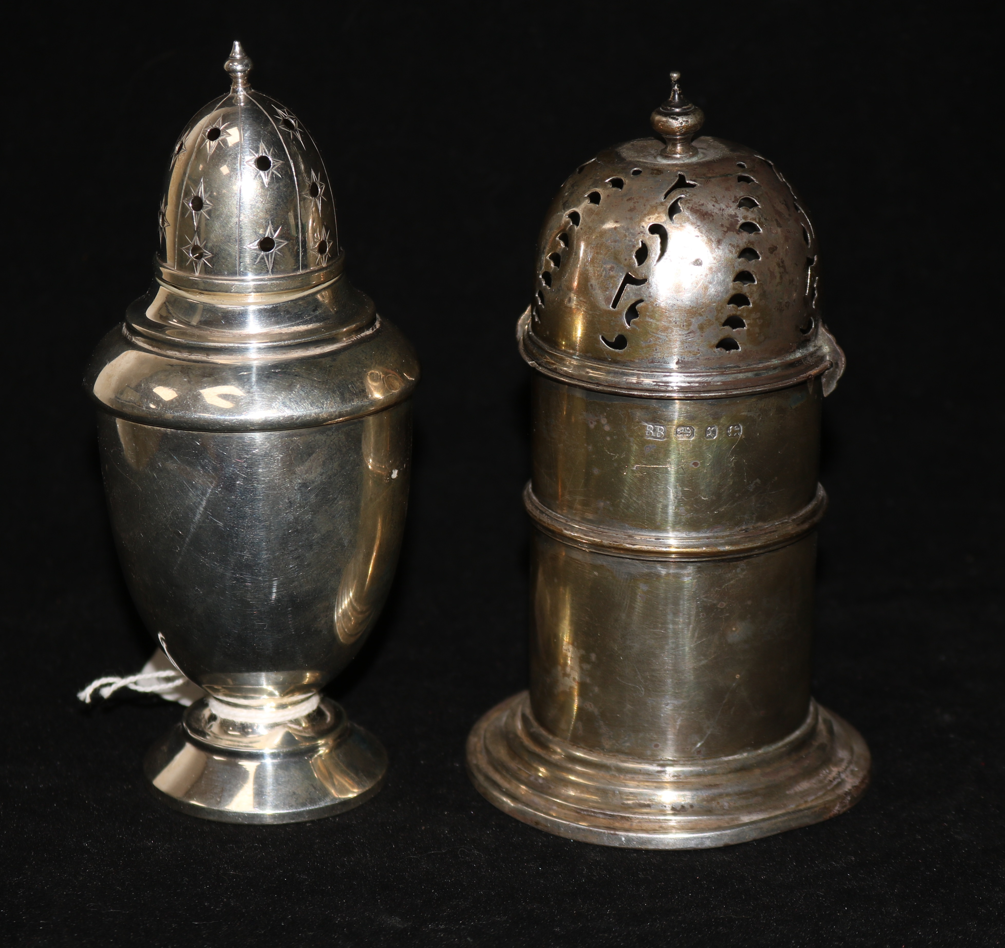Two silver sugar sifters.
