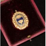 A cased late Victorian 9ct gold football medal, 1.25in.