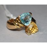 An 18ct gold and two colour topaz ring, size O.