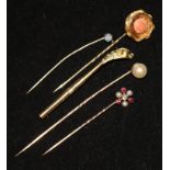 Four gem set tie pins and dog hat pin top.