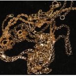An 18ct gold ropetwist necklace, a 9ct gold necklace and bracelet and two other chains.
