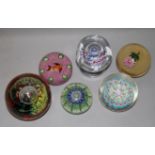 Six glass paperweights