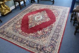 A Persian claret ground carpet, 290 x 225cm