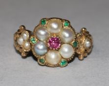 A late Victorian gold and gem set cluster ring, size M.