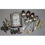 A silver mounted clock, spoons, penknives etc