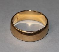 An 18ct gold wedding band, 8.5 grams, size R.