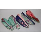 A pair of embroidered silk Chinese shoes and 3 others